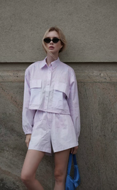 a lady in a two-piece set